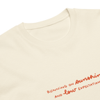 Running on sunshine premium t-shirt in Ivory.